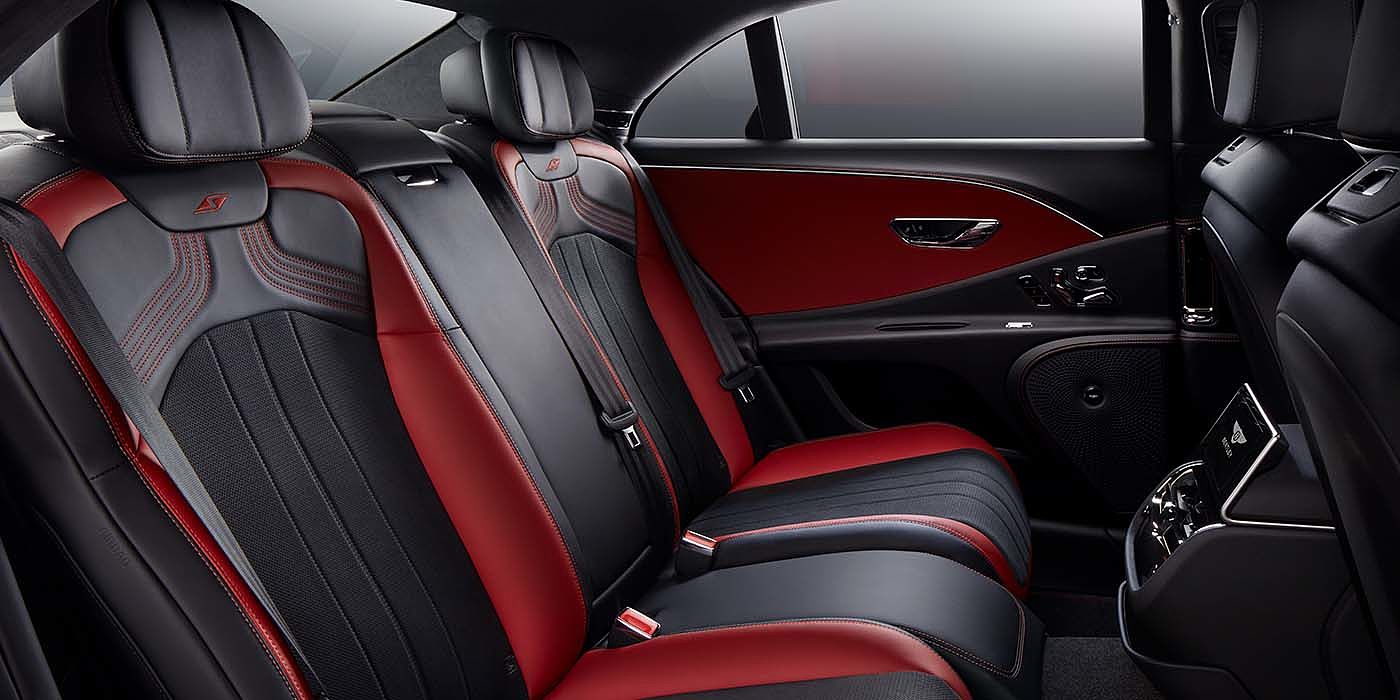 Bentley Riga Bentley Flying Spur S sedan rear interior in Beluga black and Hotspur red hide with S stitching