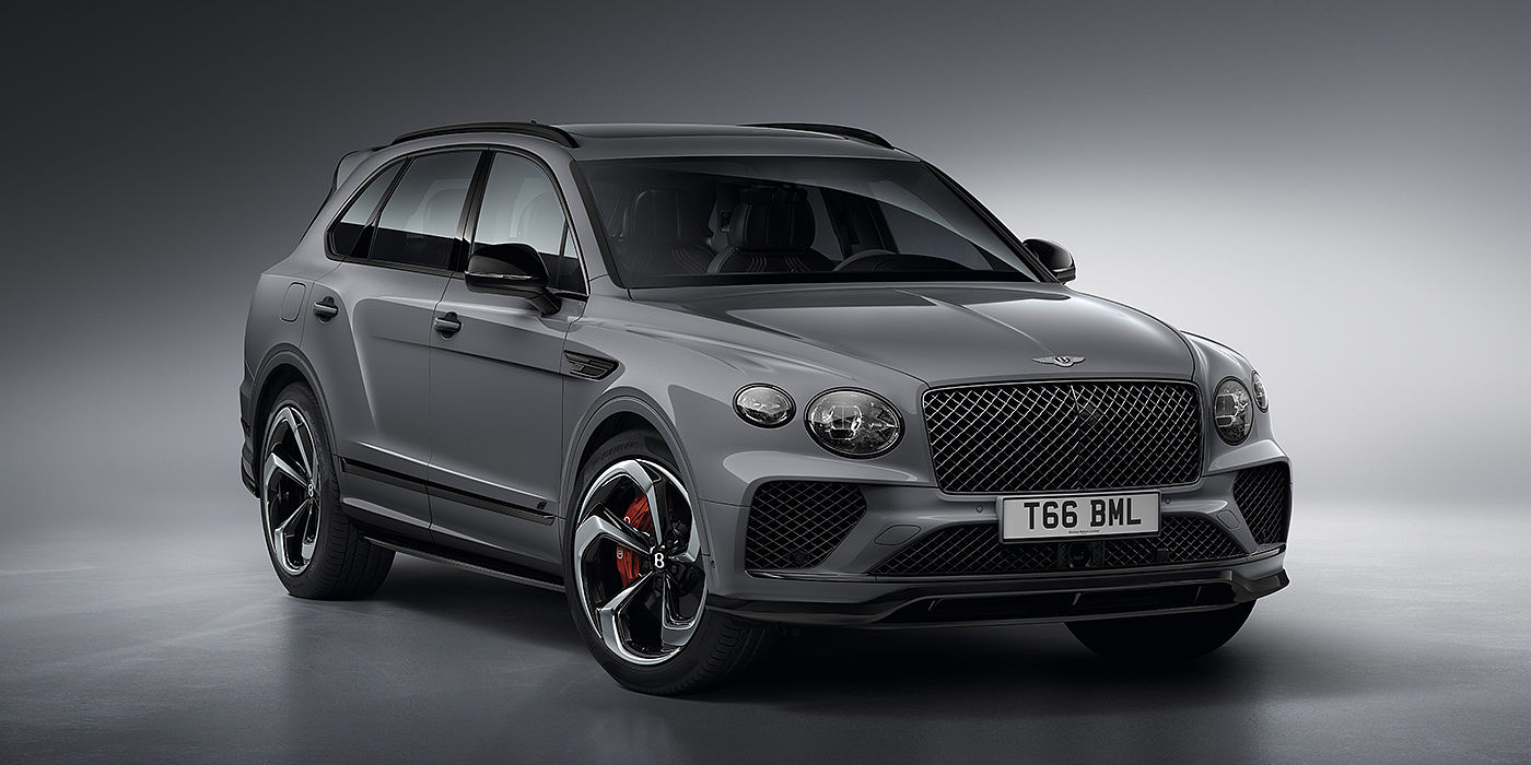 Bentley Riga Bentley Bentayga S in Cambrian Grey paint front three - quarter view with dark chrome matrix grille and featuring elliptical LED matrix headlights. 