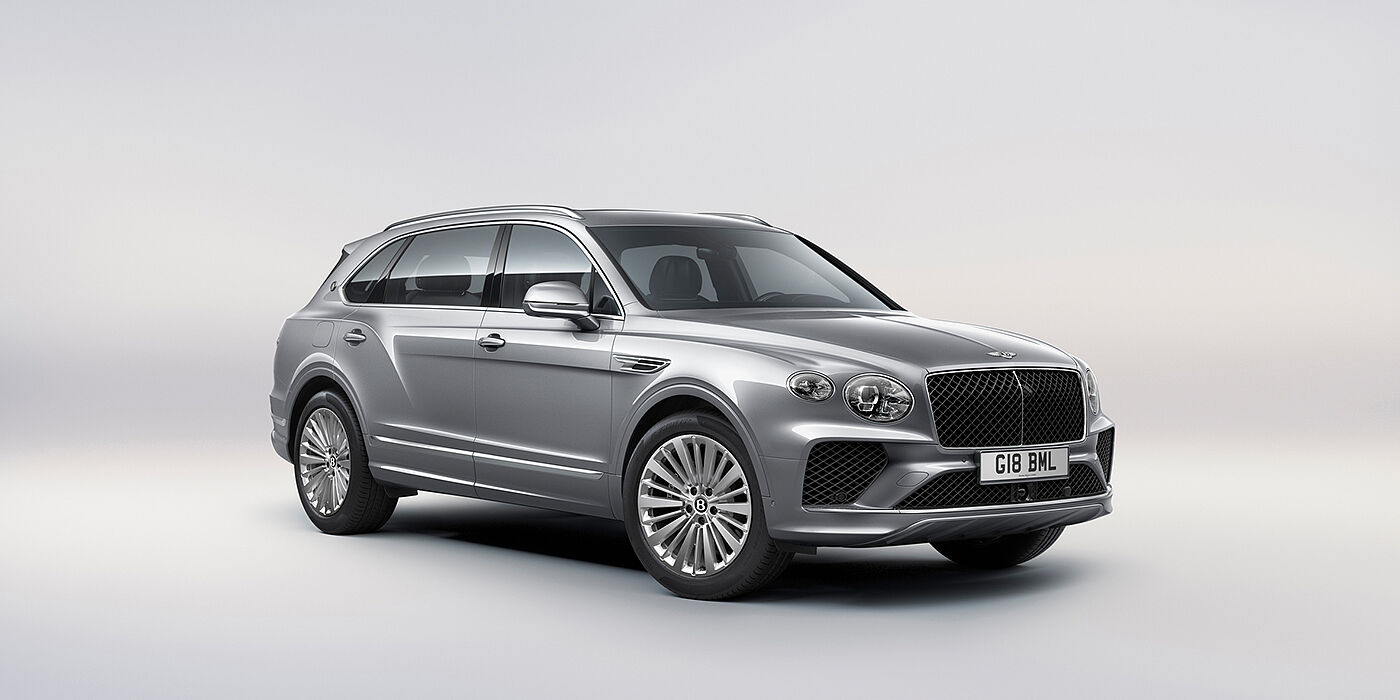 Bentley Riga Bentley Bentayga Extended Wheelbase luxury SUV front three quarter view in Moonbeam paint with 21 inch five spoke painted wheels
