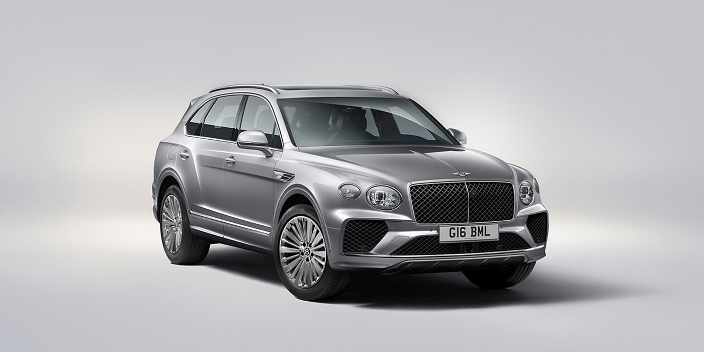 Bentley Riga Bentley Bentayga luxury SUV front three quarter view in Moonbeam paint with matrix grille and 21″ 5 spoke painted wheels