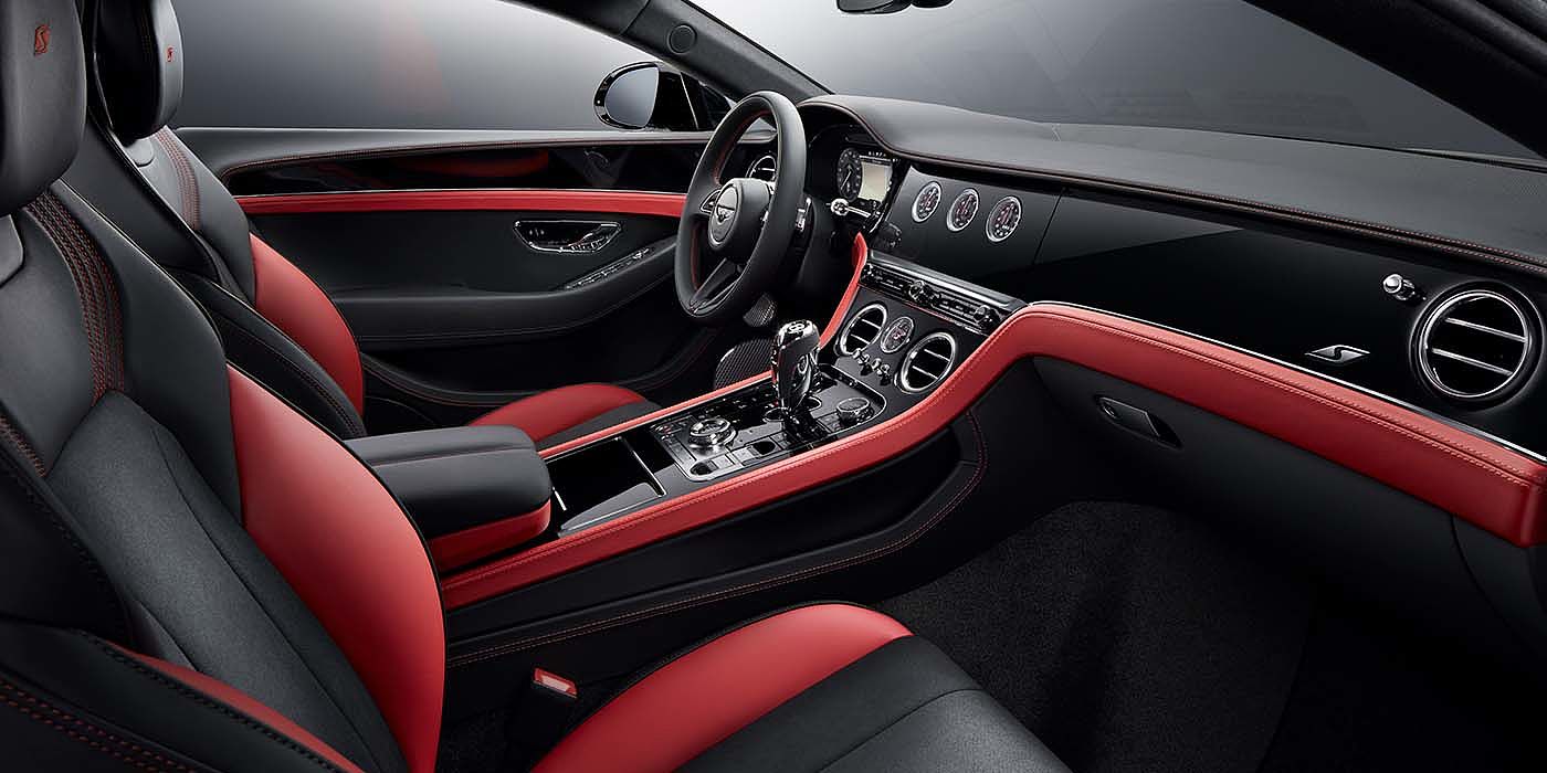 Bentley Riga Bentley Continental GT S coupe front interior in Beluga black and Hotspur red hide with high gloss Carbon Fibre veneer