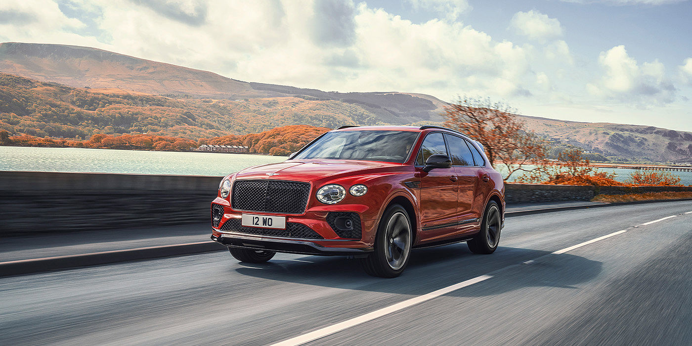 Bentley Riga Bentley Bentayga S SUV in Candy Red paint front 34 dynamic