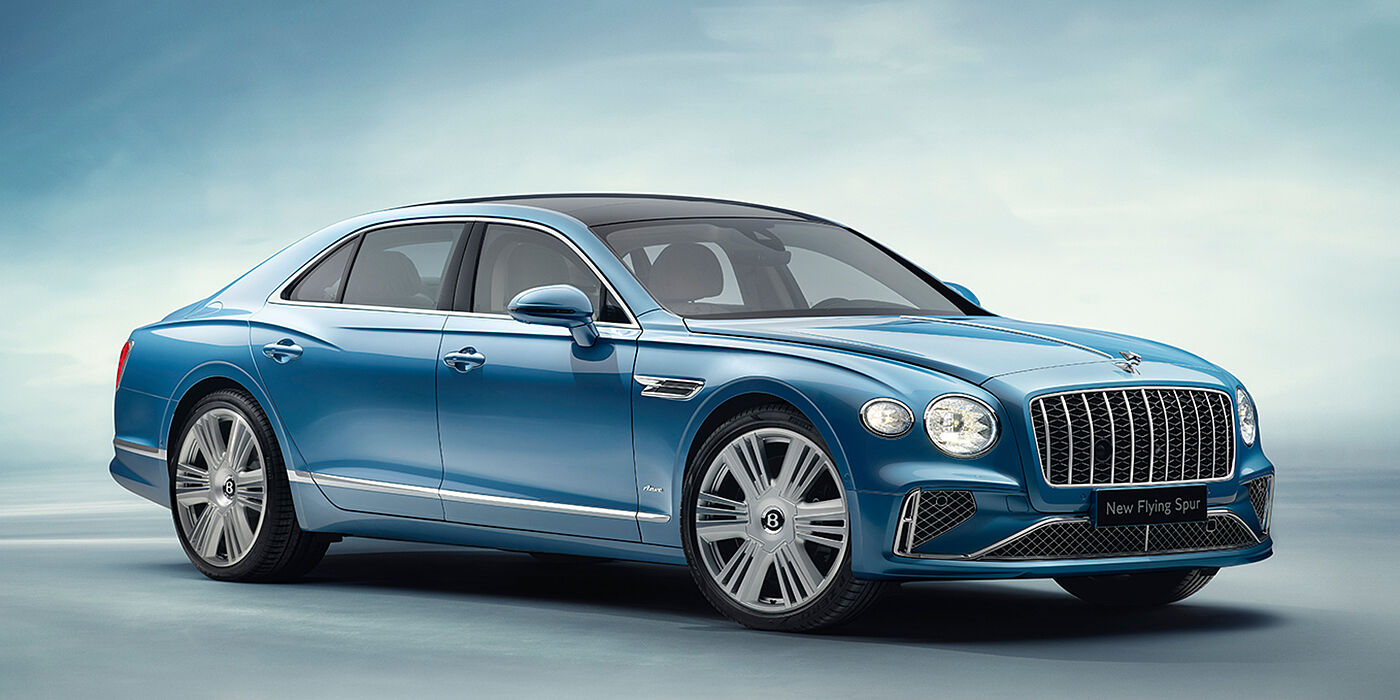 Bentley Riga New Bentley Flying Spur Azure sedan front view in Light windsor blue by Mulliner paint with 22 inch Azure wheels and chrome exterior details