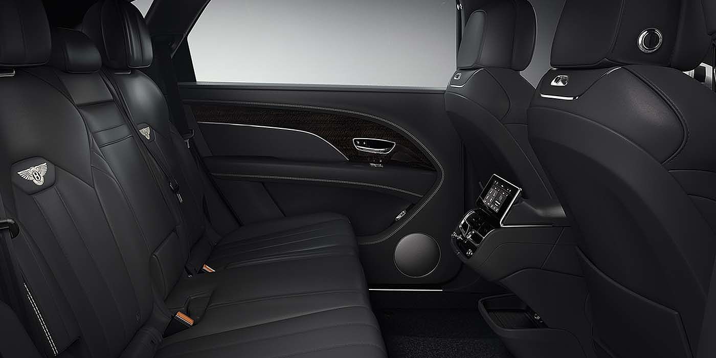 Bentley Riga Bentley Bentayga EWB SUV rear interior in Beluga black leather