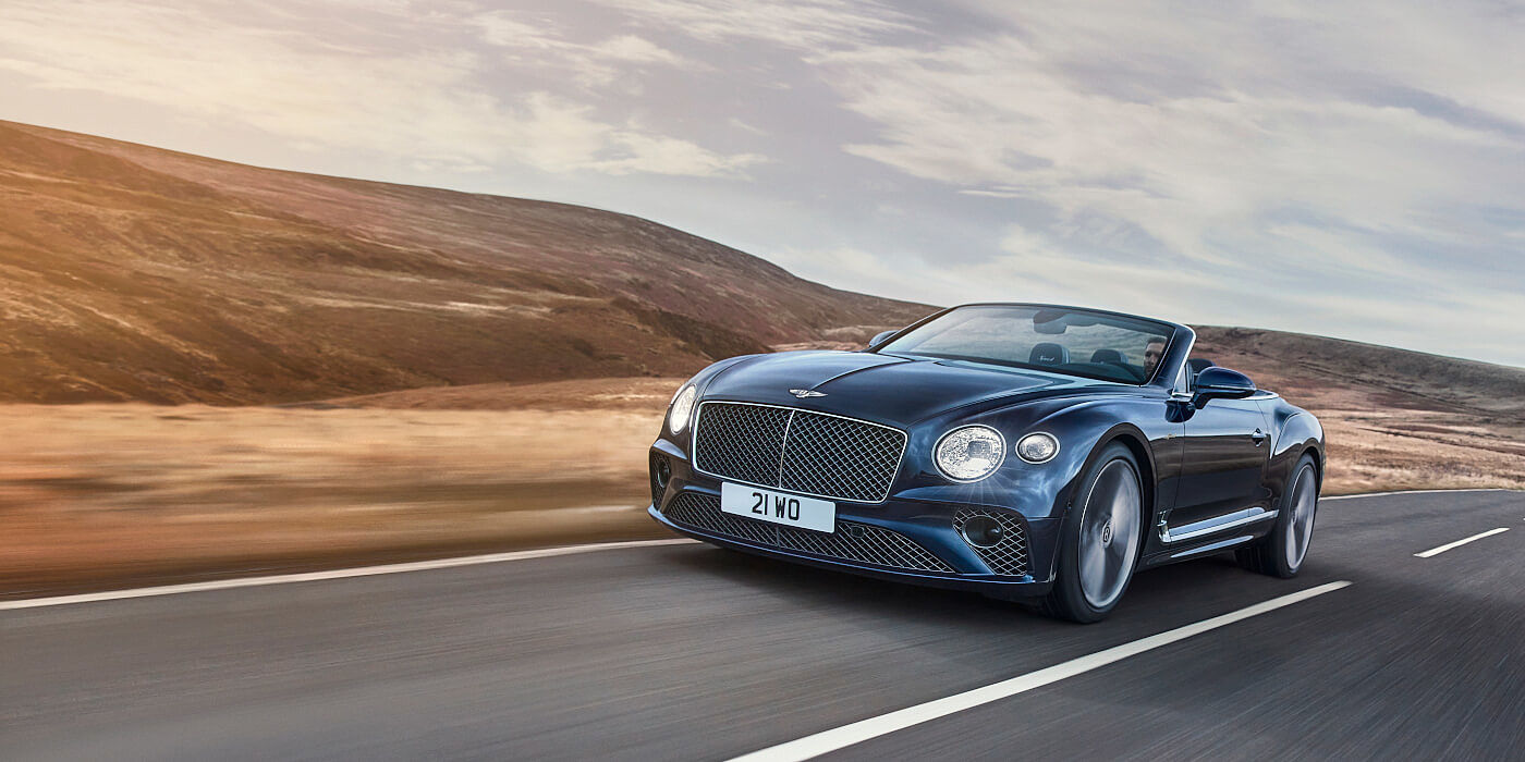 Bentley Riga Bentley Continental GTC Speed convertible in Peacock paint side front 34 dynamic