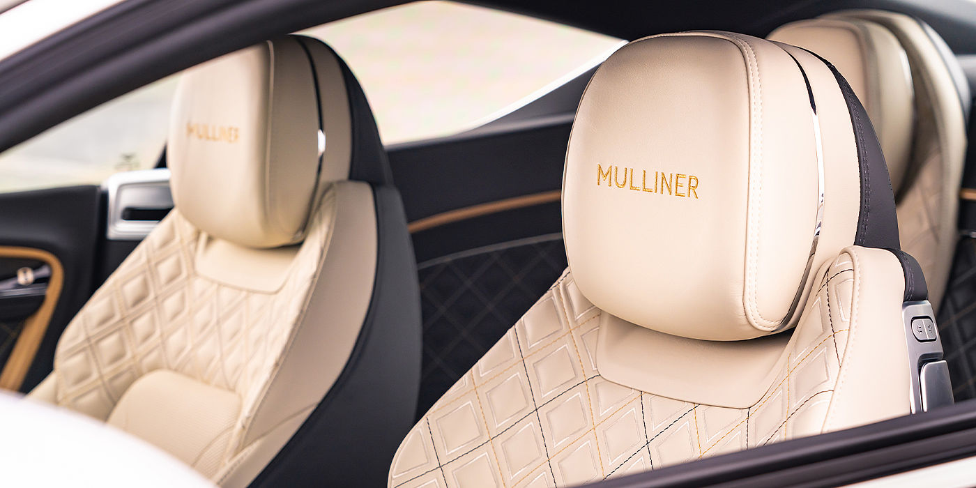 Bentley Riga Bentley Continental GT Mulliner coupe seat detail in Beluga black and Linen hide